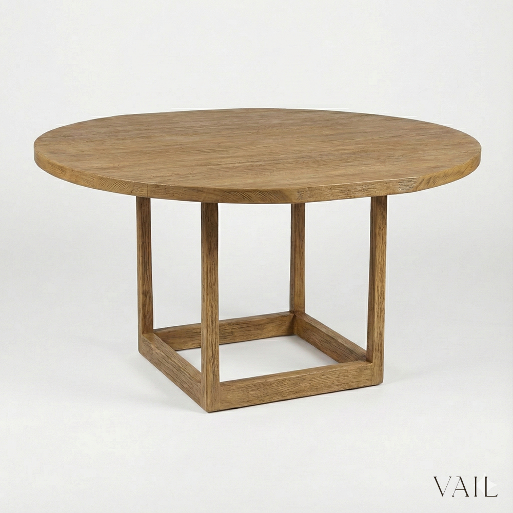 Round wooden table with a minimalist design on a white background, featuring the brand 'VAIL'.