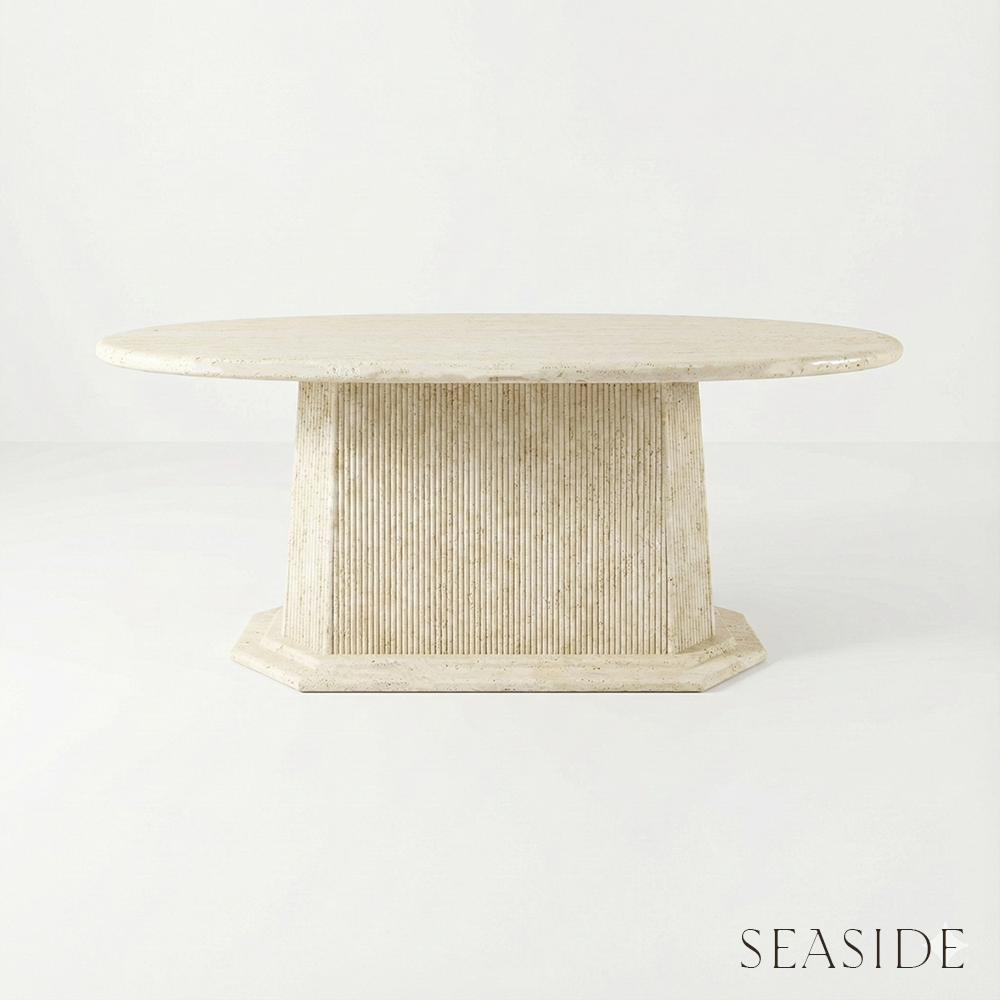 Beige marble table with wicker base on a white background