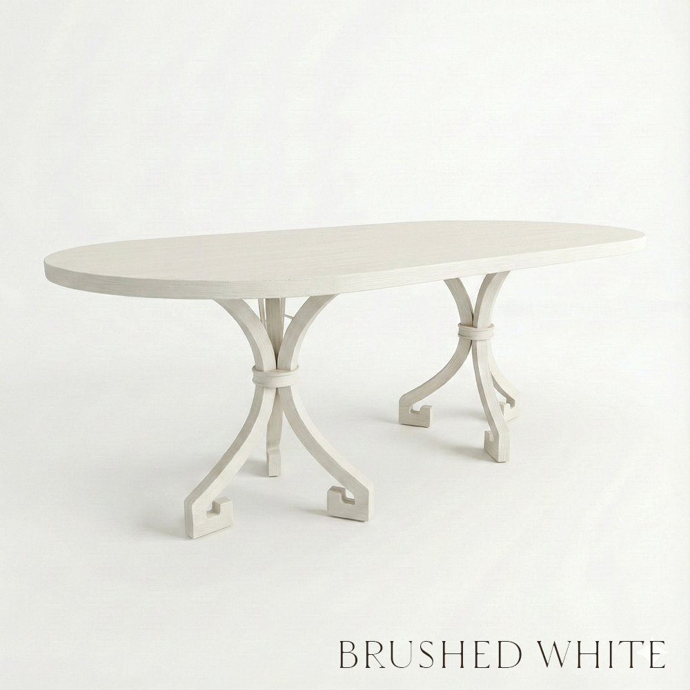 White oval table with decorative metal legs on a white background