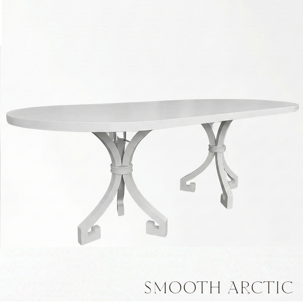 White oval table with decorative legs on a light gray background
