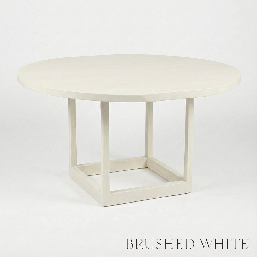 Round white table with a brushed white finish on a light gray background