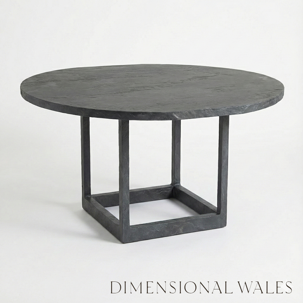 Round dark gray table with a minimalist design on a white background, featuring the brand 'Dimensional Wales'.