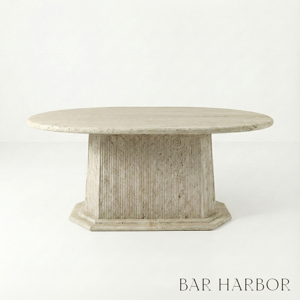 Round stone table with a textured base on a white background, featuring the 'Bar Harbor' brand.