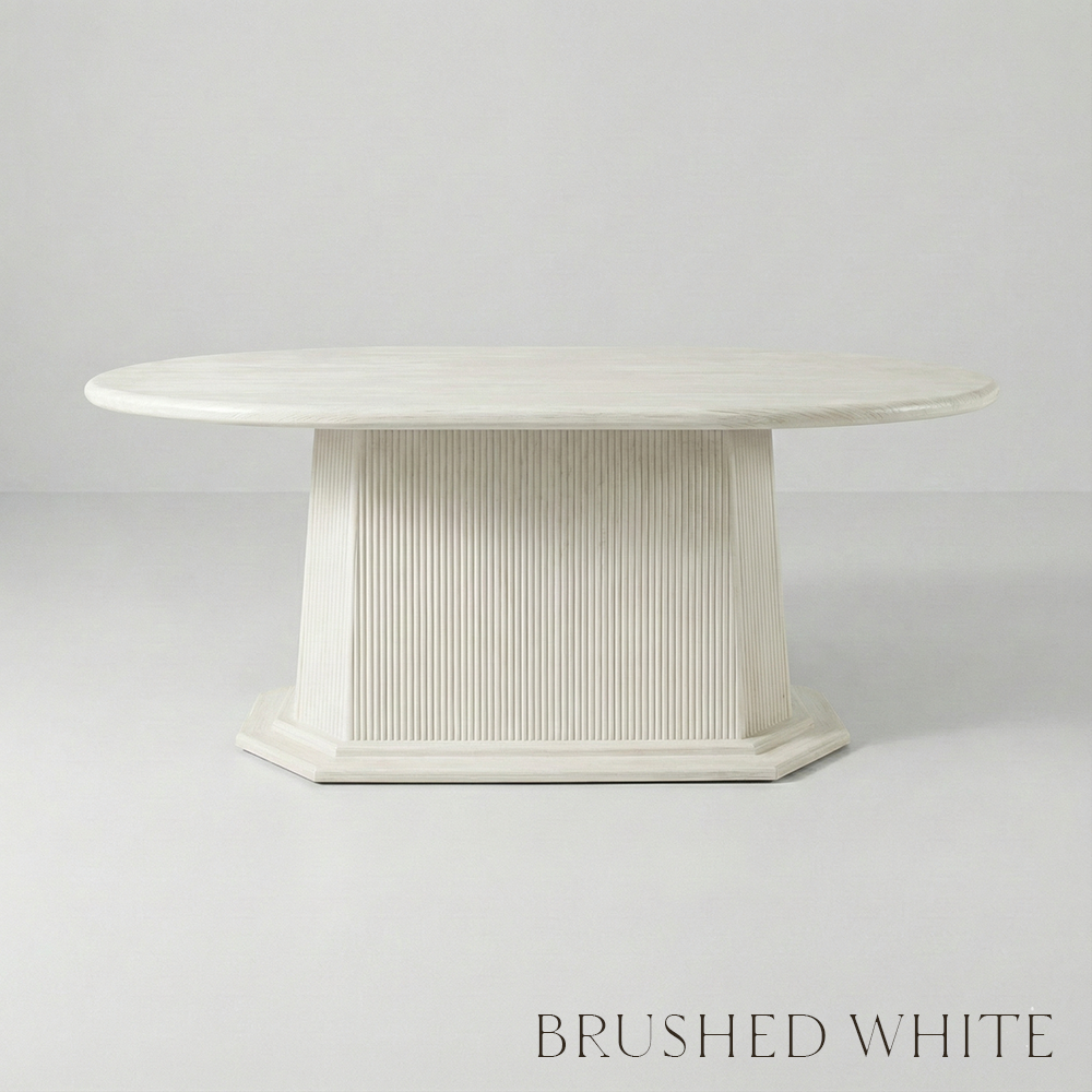 White round table with a textured base on a light gray background