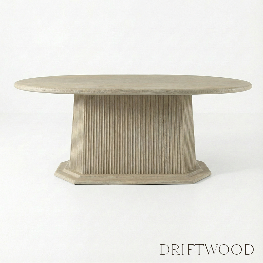 Round wooden table with a textured surface on a white background, labeled 'Driftwood'.