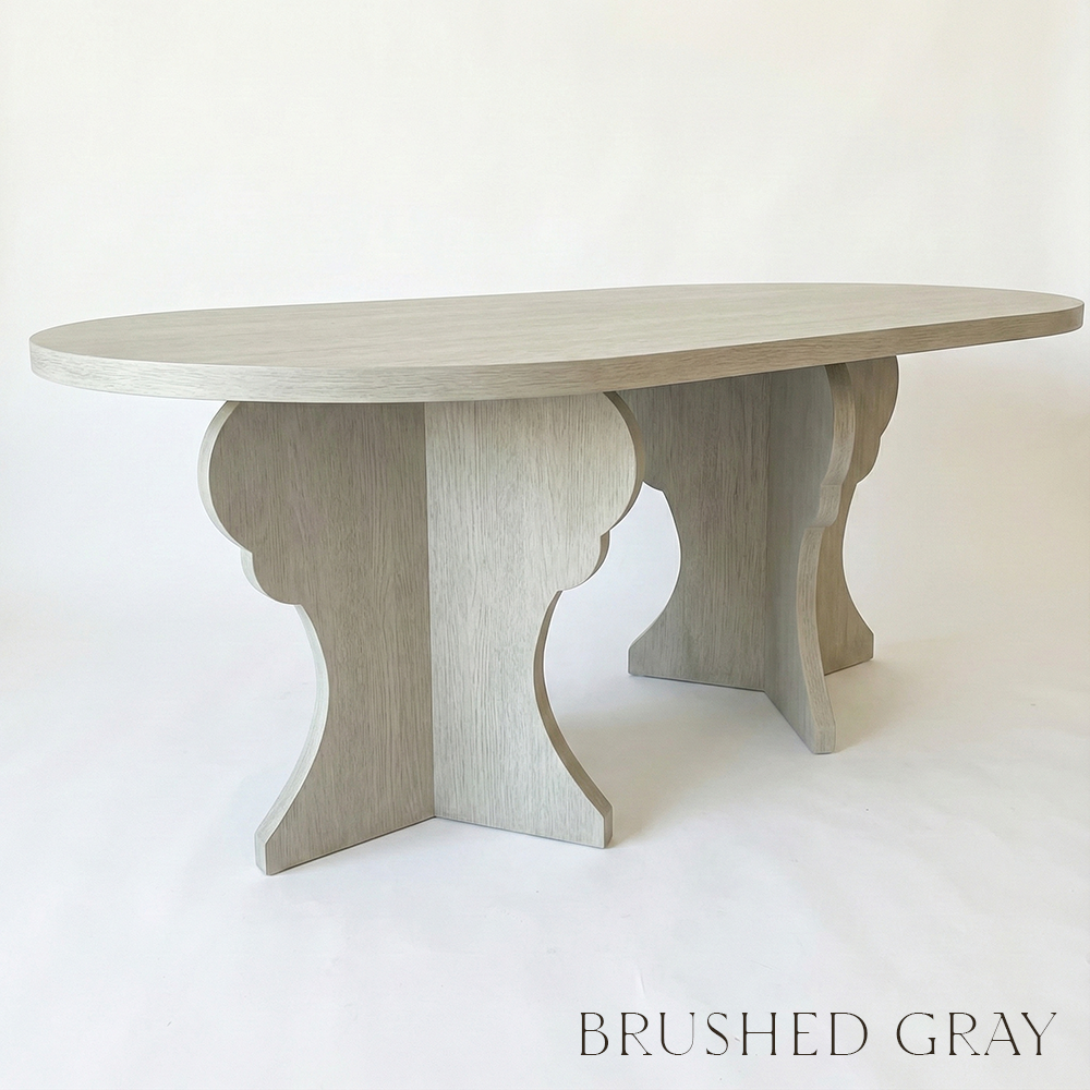 Brushed gray dining table on a white background